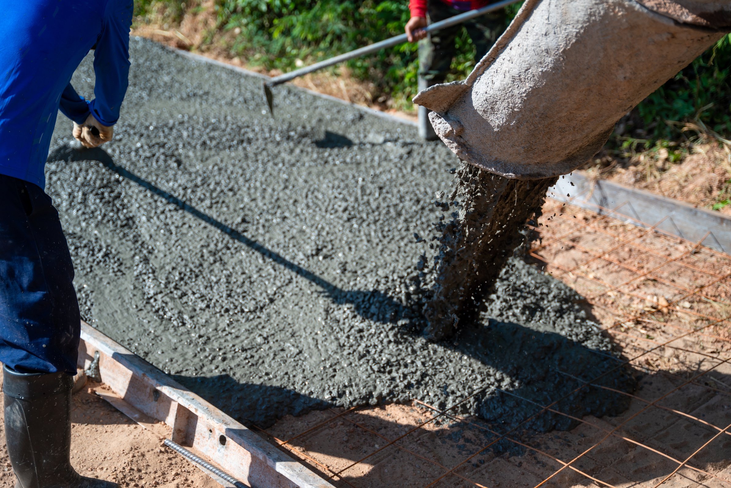 Concrete, Pouring ready-mixed concrete after placing steel r